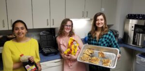 smaller version-Intern holding pan with waffles with two other girls