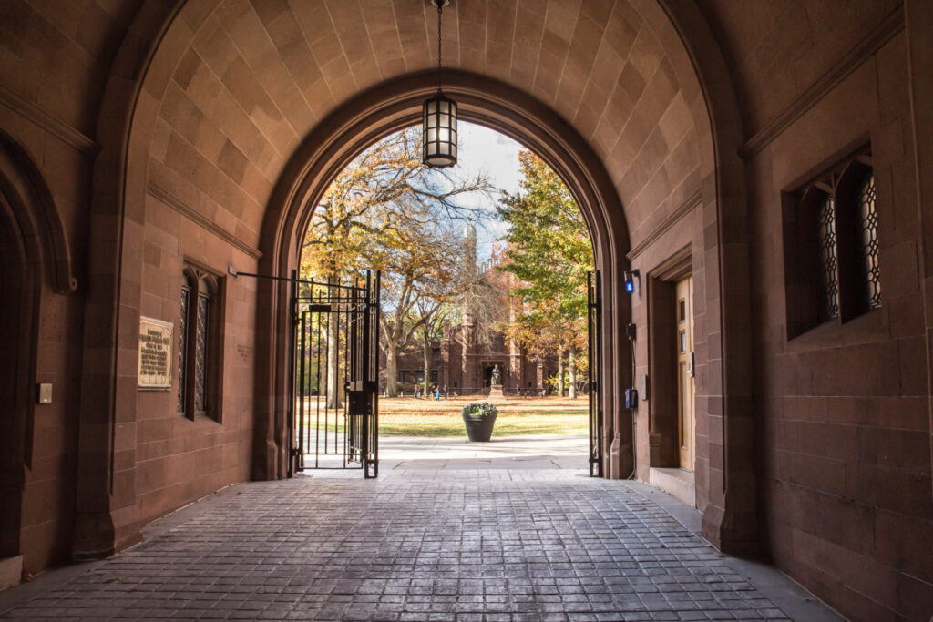 Phelps Gate at Yale University looking in towards the campus with people visible in the distance.