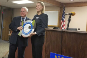 Man and woman holding certification award-Howell-RRC