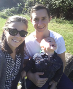 Man and woman posing with baby