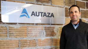 Andrew next to Autaza sign