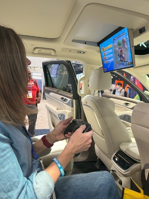 Passenger playing video games in back of robotaxi