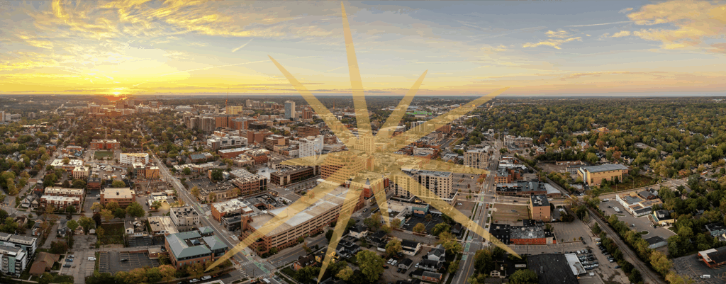 Ann Arbor cityscape, aerial, with SPARK logo starburst